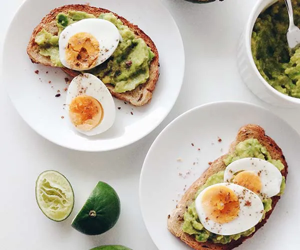 eggs avocado toast on a table