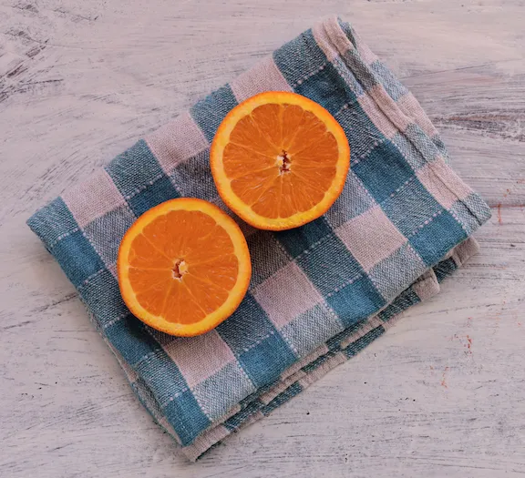 Oranges oranges on plaid dish towel