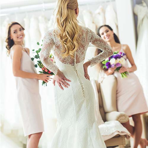 Bride trying on gown