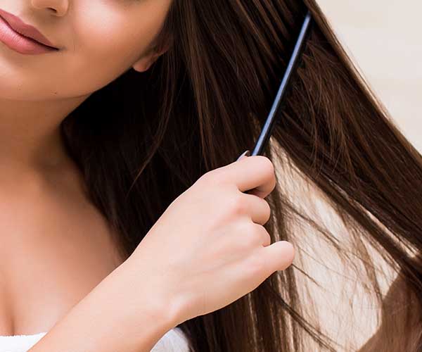 woman combing hair