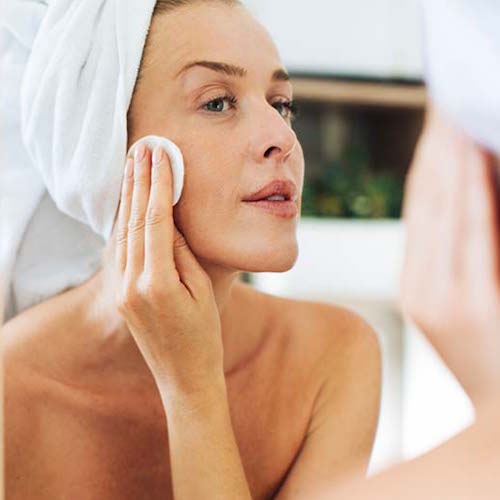 woman applying skincare products