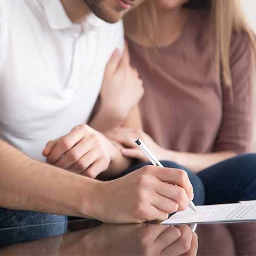 Couple signing contract