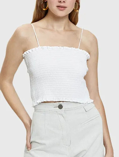 Edie smocked top with elegant silhouette and style.