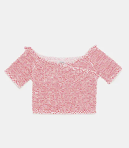 Polka dot T-shirt showcasing playful design details.