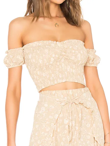 Secret crush smocked top with trendy design elements.