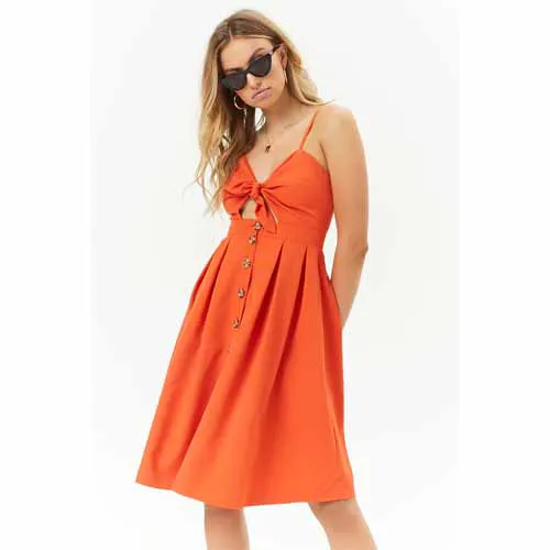 Elegant orange-themed wedding decor with candles