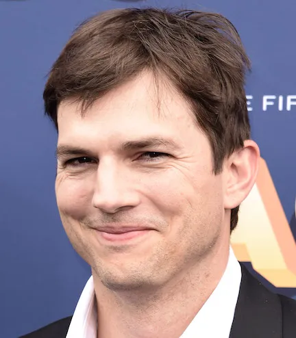 Ashton Kutcher posing for a photo shoot.