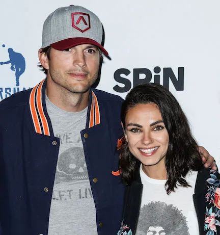 Ashton Kutcher and Mila Kunis together at an event.