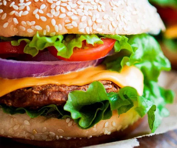 Juicy gourmet burger with fresh toppings and melted cheese