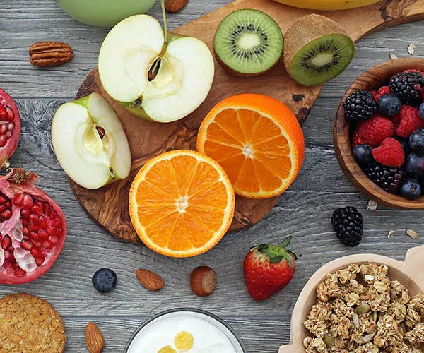 Healthy fruit and granola bowl with yogurt