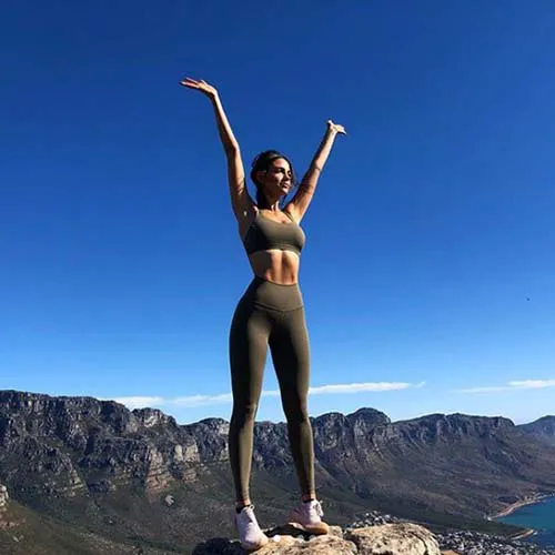 Eiza Gonzalez posing with a vibrant green juice.