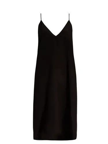 V-neck silk slip dress in soft lighting