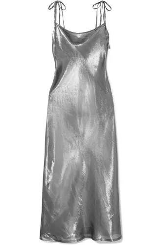 Elegant metallic silk blend dress worn by a celebrity.