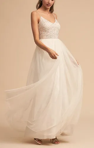 Violetta dress featuring elegant design and flowing fabric