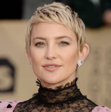Kate Hudson in a fashionable ensemble during a photoshoot.