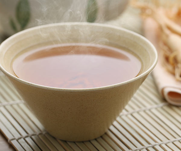 white tea in a mug on a table