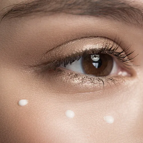 woman applying eye cream