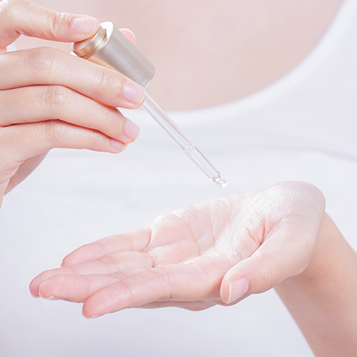 woman using a serum