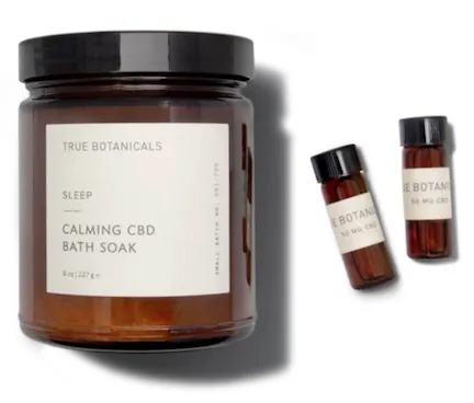 A collection of True Botanicals natural beauty products in vibrant packaging.