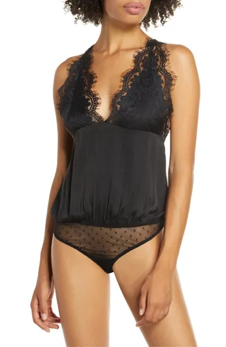 Model wearing a stylish Melrose bodysuit for modern fashion.