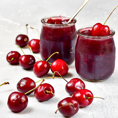 Cherry jam and fresh cherries.