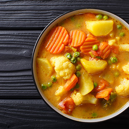 A bowl of vegetable curry.