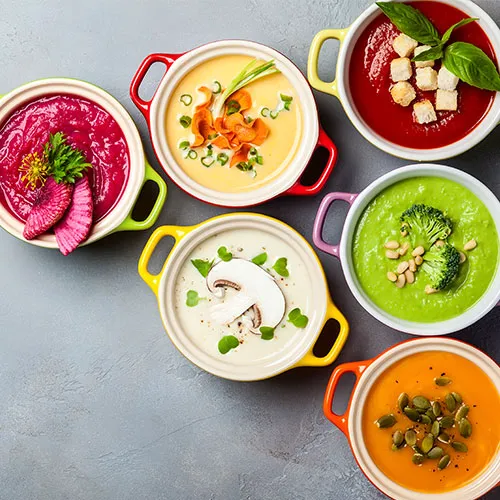 "Soup in a bowl garnished with herbs"