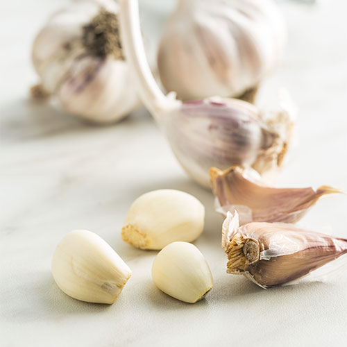 Cloves of garlic on a table.