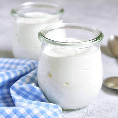 Yogurt in a glasses on a table.