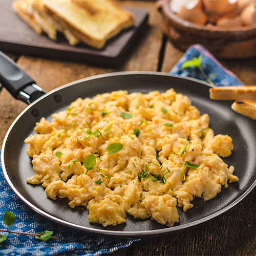 Scrambled eggs on a plate.