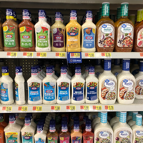 A shelf of salad dressings.