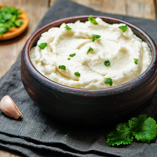 A bowl of mashed cauliflower.