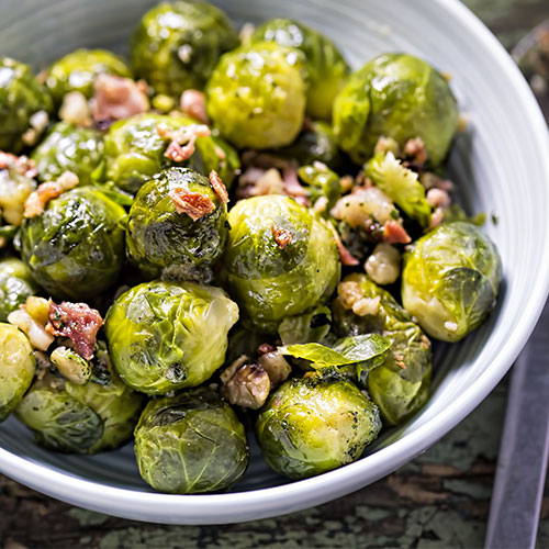 Fried brussel sprouts in a bowl.