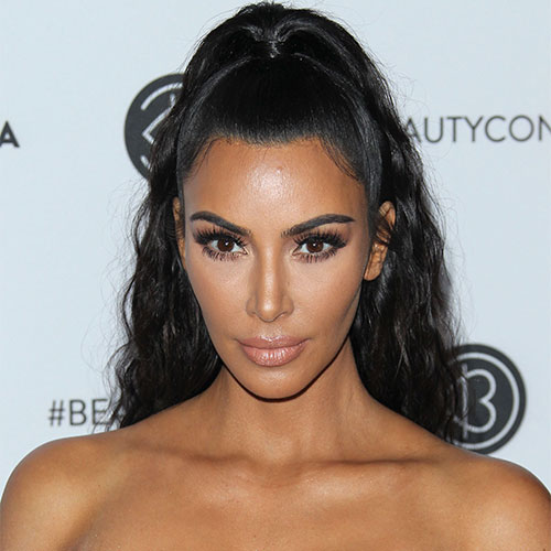 Kim Kardashian looks incredible in skintight yellow vintage