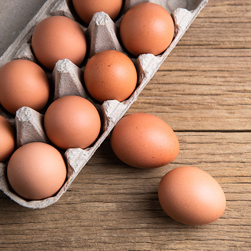 Brown eggs in a carton.