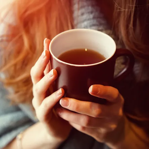 woman holding tea
