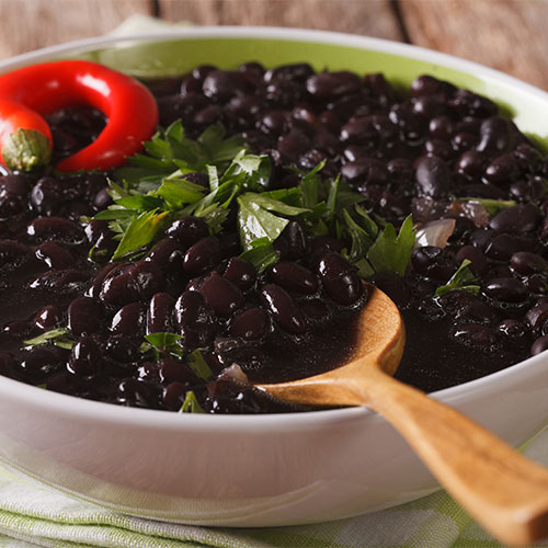 A bowl of black beans.