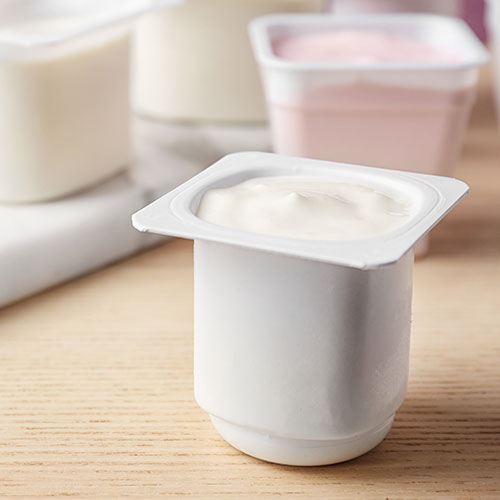 Yogurt in a while container.