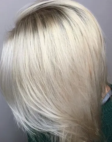 "Woman with blonde hair showing color-treated hairstyle"