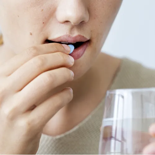woman taking vitamin