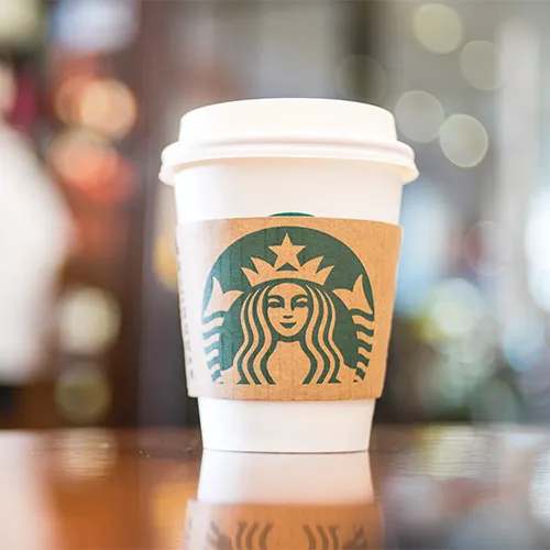 "Starbucks coffee with holiday decorations"