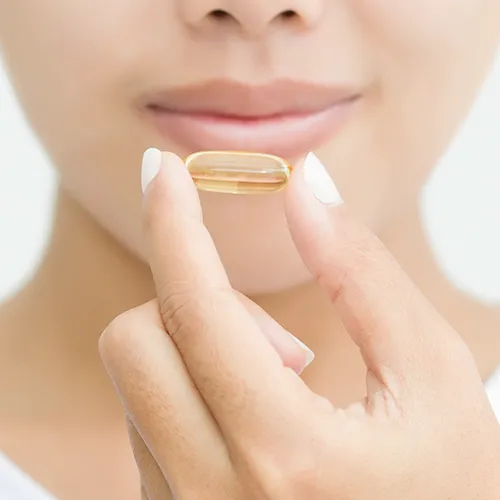 woman taking vitamin