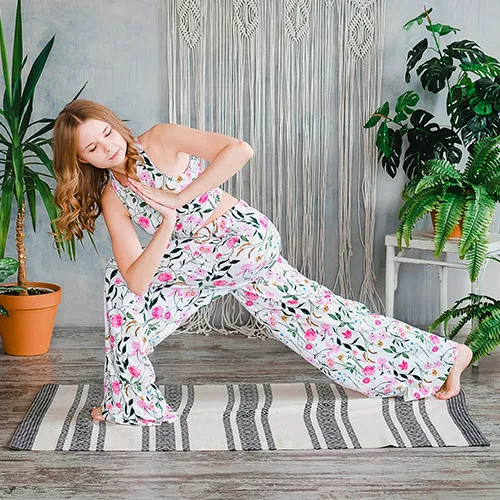 Woman doing prayer twist.