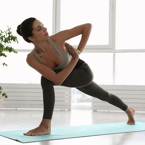 Woman doing prayer twist.