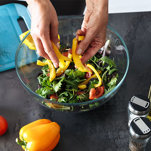 A person making a salad.