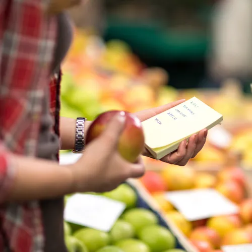 Eco-friendly paper grocery list for sustainable shopping.
