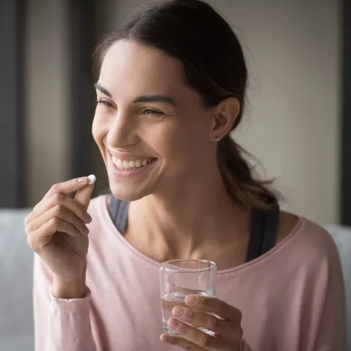 woman taking pill