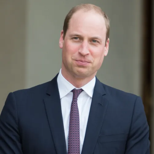 Prince William smiling at a public event.