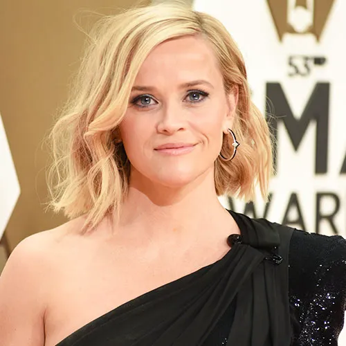 Reese Witherspoon showcasing elegant style in a glamorous outfit.