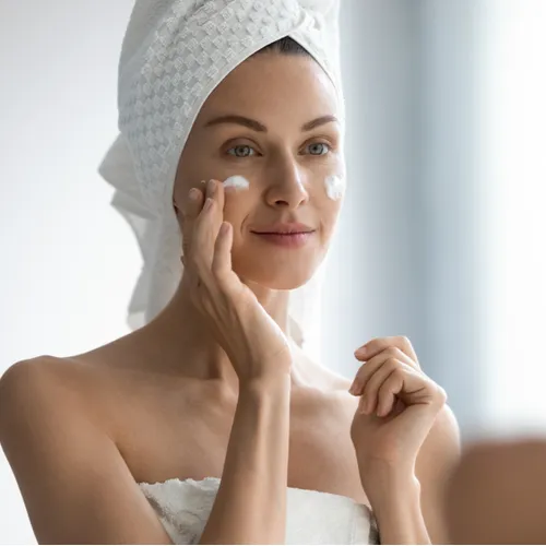 woman looking in mirror